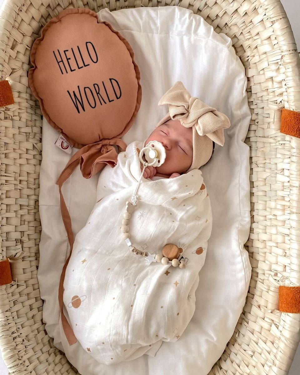 Tampilan hangat ruang istirahat bayi bersama perlengkapan linen alami BabyNest