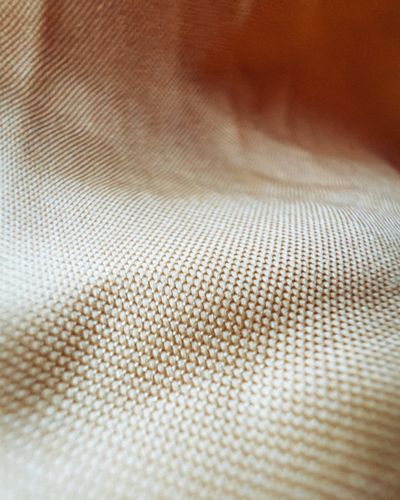 Detail tenunan linen alami dan katun organik GOTS